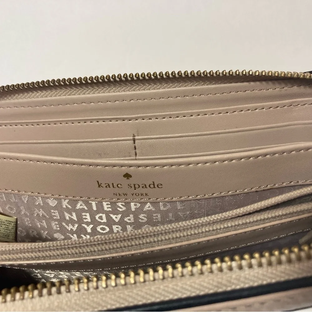 Kate Spade wallet pebble texture leather mauve color black trim tassel